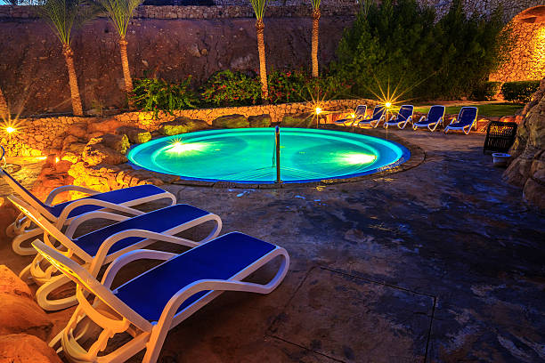 istock Evening view for luxury swimming pool in night illumination 509116884