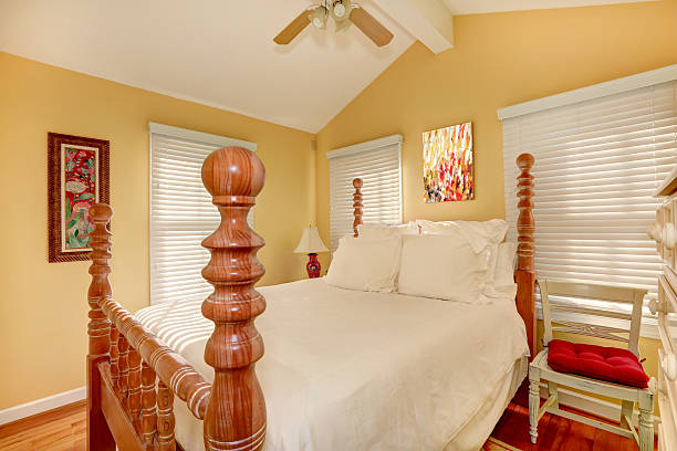 istock Carved wood high pole bed in bright room 509117031