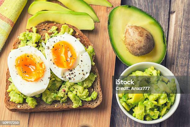 Toast With Avocado And Egg Stock Photo - Download Image Now - Avocado, Toasted Bread, Egg - Food