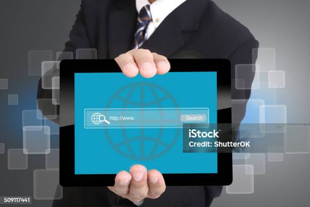 Businessman Used Hand For Hold Touch Pad To Search Internet Stock Photo - Download Image Now