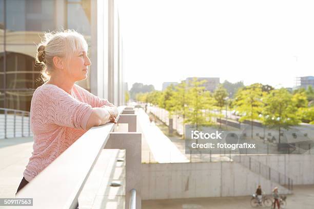 Profil Mature Woman Portrait In Modern Architecture Stock Photo - Download Image Now