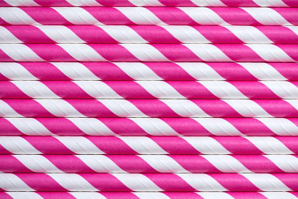 istock Background of Shocking Pink striped straws 509119581