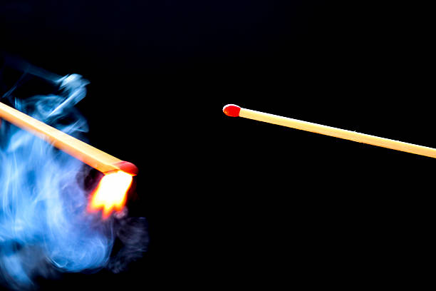 istock Igniting match about to ignite another red match 509119606