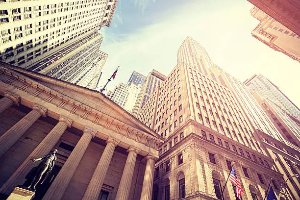 Photo of Vintage toned Wall Street at sunset, NYC.