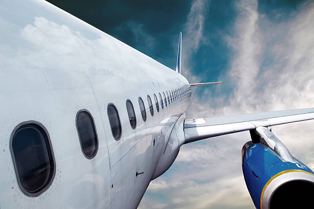 istock Airplane at fly on the sky with clouds 509136741