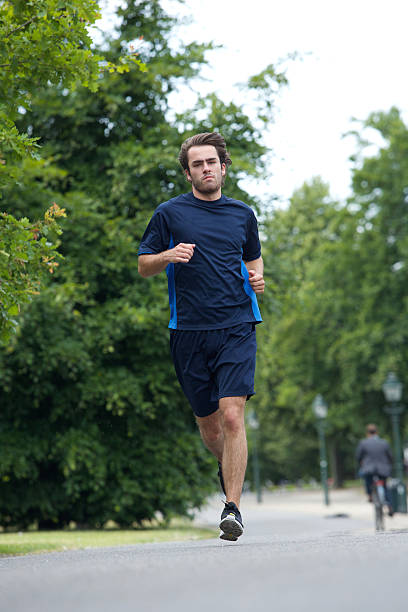 istock Full body of a young man jogging 509137503
