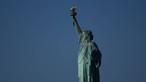 istock Statue of Liberty against blue sky 509138019
