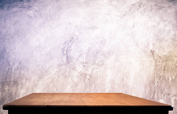 istock Concrete wall and wooden table 509138975