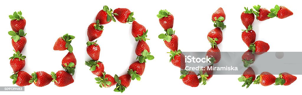 Word "love" painted from a strawberry Image of the word "love" painted from a strawberry Berry Stock Photo