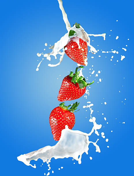 istock Juicy strawberries in milk splashes 509139529
