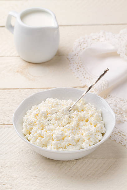 istock Cottage cheese and dairy cream on a white wooden table 509140313