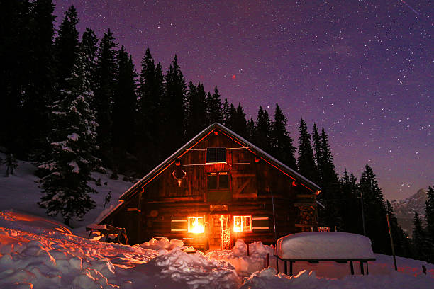 istock Lightened mountain hut in the austrian alps with milky way 509140839