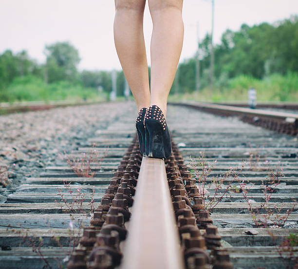 istock Woman legs walking on railway. 509141253