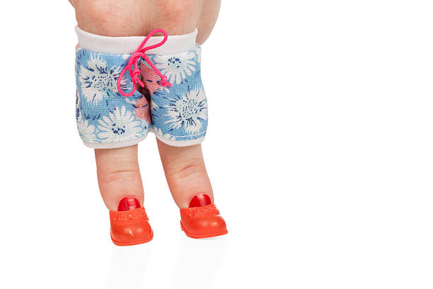 istock Female finger in shorts and boots 509167374