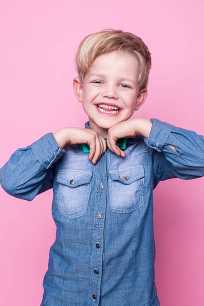 istock Young beautiful boy with blue shirt and butterfly tie 509167692