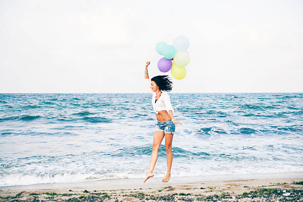 istock Woman jumping on the beach 509168976