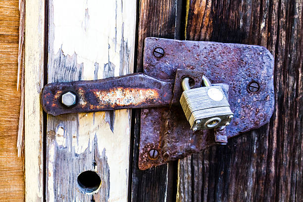 istock Weathered wooden door with lock 509169369