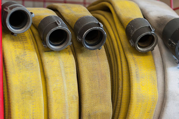 Fire hose on the hose rack fire hose ready for use fire hose stock pictures, royalty-free photos & images