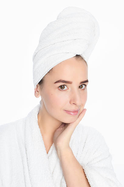 istock Beautiful young woman in bathrobe and towel on her head 509169938