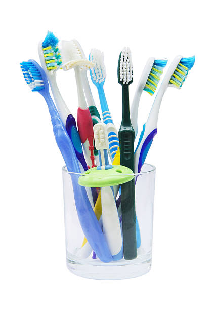 istock Colorful toothbrushes in glass 509171099
