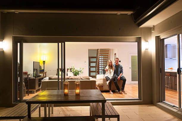 Couple relaxing in their home at night.