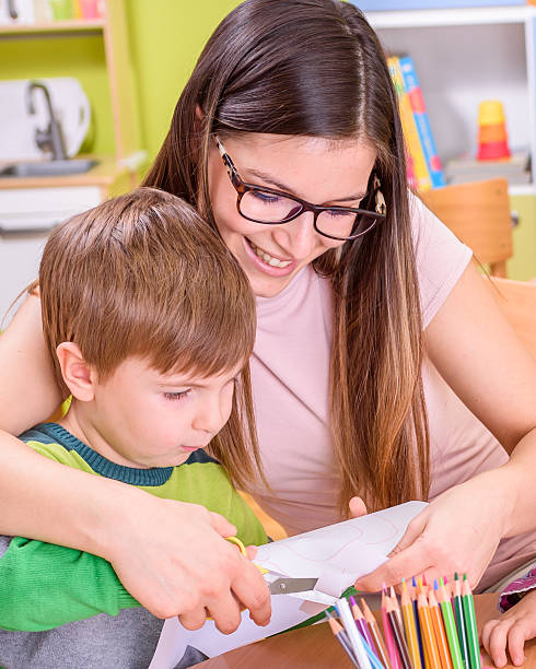 istock Mother Helps Child in Creative Activities 509172128