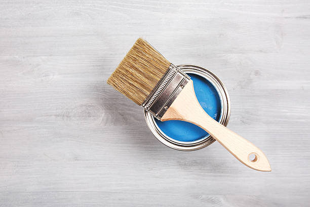 istock Paintbrush and can with paint. Top view 509172248