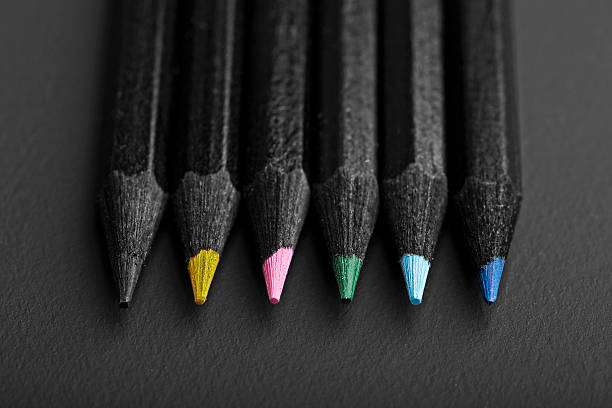 istock Set beautiful black, colored pencils on black background 509172939