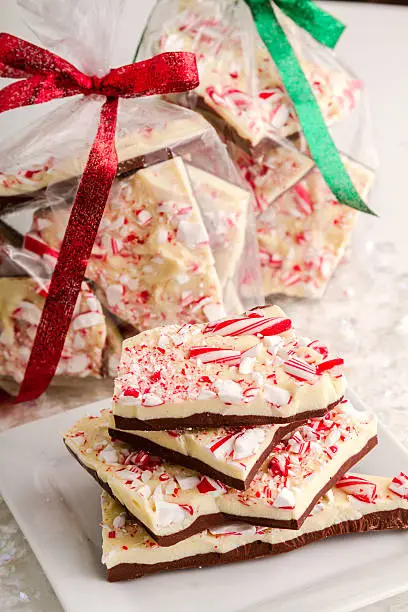 Holiday gift packages filled with chocolate peppermint bark candy