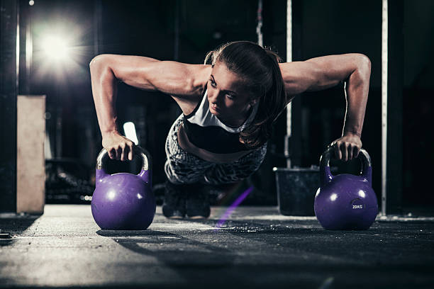 istock Young woman in a cross training rack 509174334