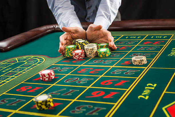 Picture of a green table and betting with chips. stock photo