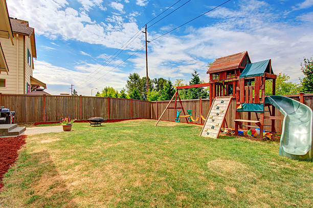 istock Fenced backyard with playground for kids 509174753