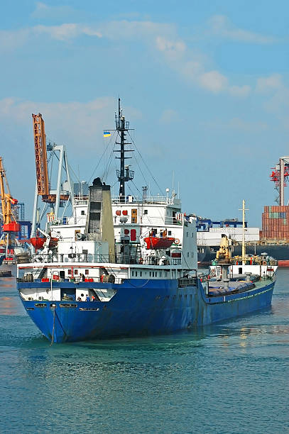 istock General cargo ship and port crane 509174940