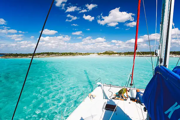 The calm and shallow turquoise waters in Exumas archipelago in The Bahamas are perfect for sailing, yachting, and island hopping in the Caribbean.