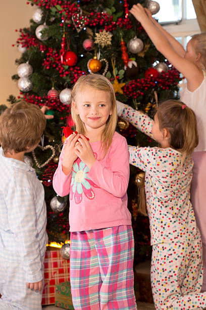 istock Family Decorating a Christmas Tree 509176775