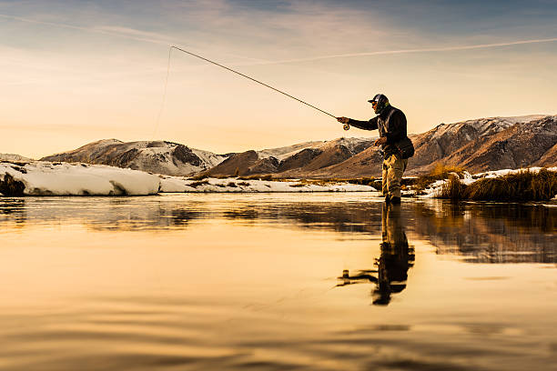 istock Fly Fisherman High Sticking In The River At Sunset 509177378