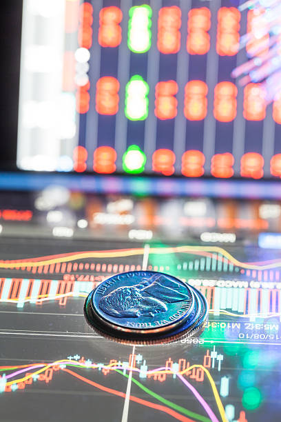 istock coin in front of stock data 509178052