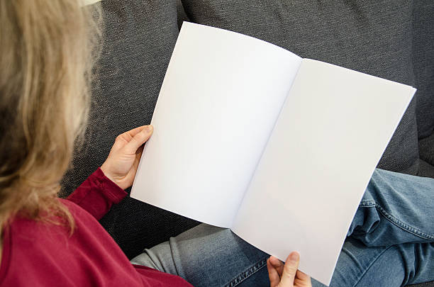 istock Woman is looking at blank brochure 509178182