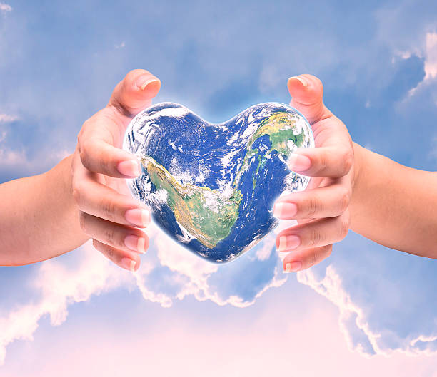 istock World in heart shape with over women human hands 509179358
