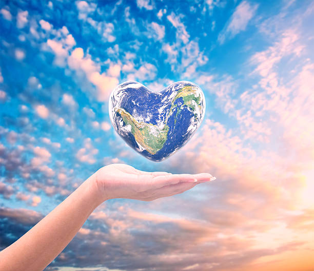 istock World in heart shape with over women human hands 509179566