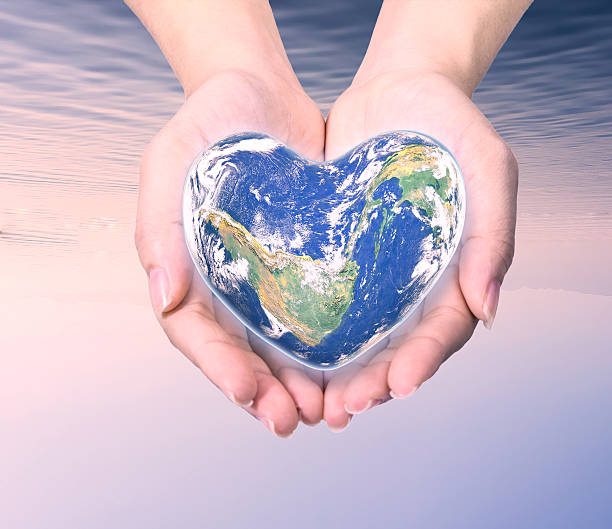 istock World in heart shape with over women human hands 509179778