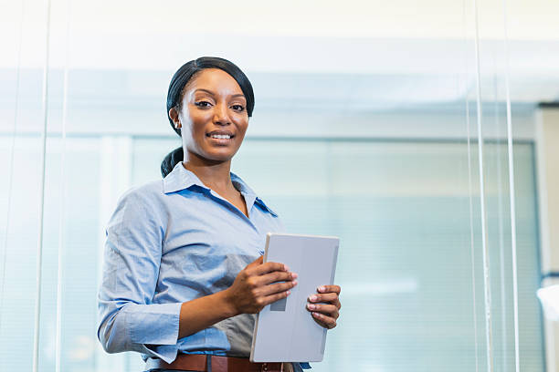 istock African American woman in office holding digital tablet 509182086