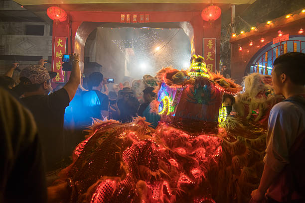 Chinese new year celebration Kolkata, West Bengal, India - February 7, 2016: Unidentified photographers taking pictures of the red dragon, celebration of Chinese New Year, on 07.02.16. It is the year of the monkey, as per chinese calender. monster energy stock pictures, royalty-free photos & images