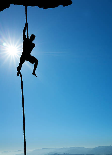 istock Silhouette of rock climber vertical image 509186026