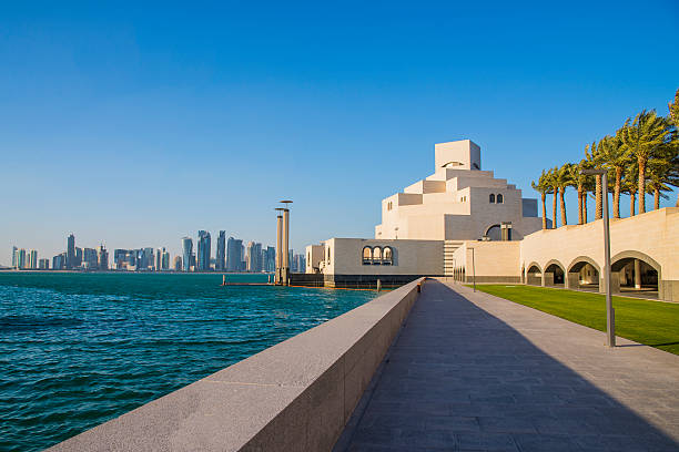 Museum of Islamic Art - Stock Image Doha, Qatar - January 30, 2016: The modern architecture of the Museum of Islamic Arts (MIA) in the city center of Doha, the capital of the Arabian Gulf country Qatar on January 30, 2016. corniche stock pictures, royalty-free photos & images