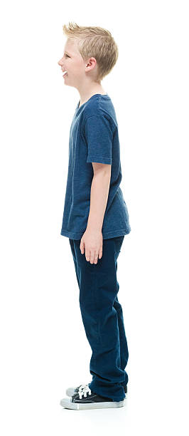 istock Smiling little boy standing and looking away 509188588