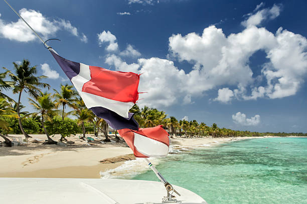 istock Dominican flag at caribbean sea 509189908