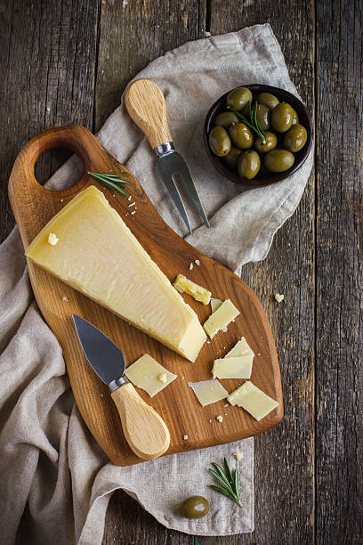 istock parmesan cheese on woden cutting board 509190610