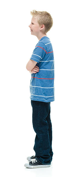 istock Smiling little boy standing with arms crossed 509191648