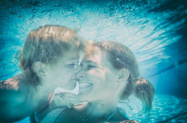 istock Underwater kisses selfie with mom and son in a pool 509192078